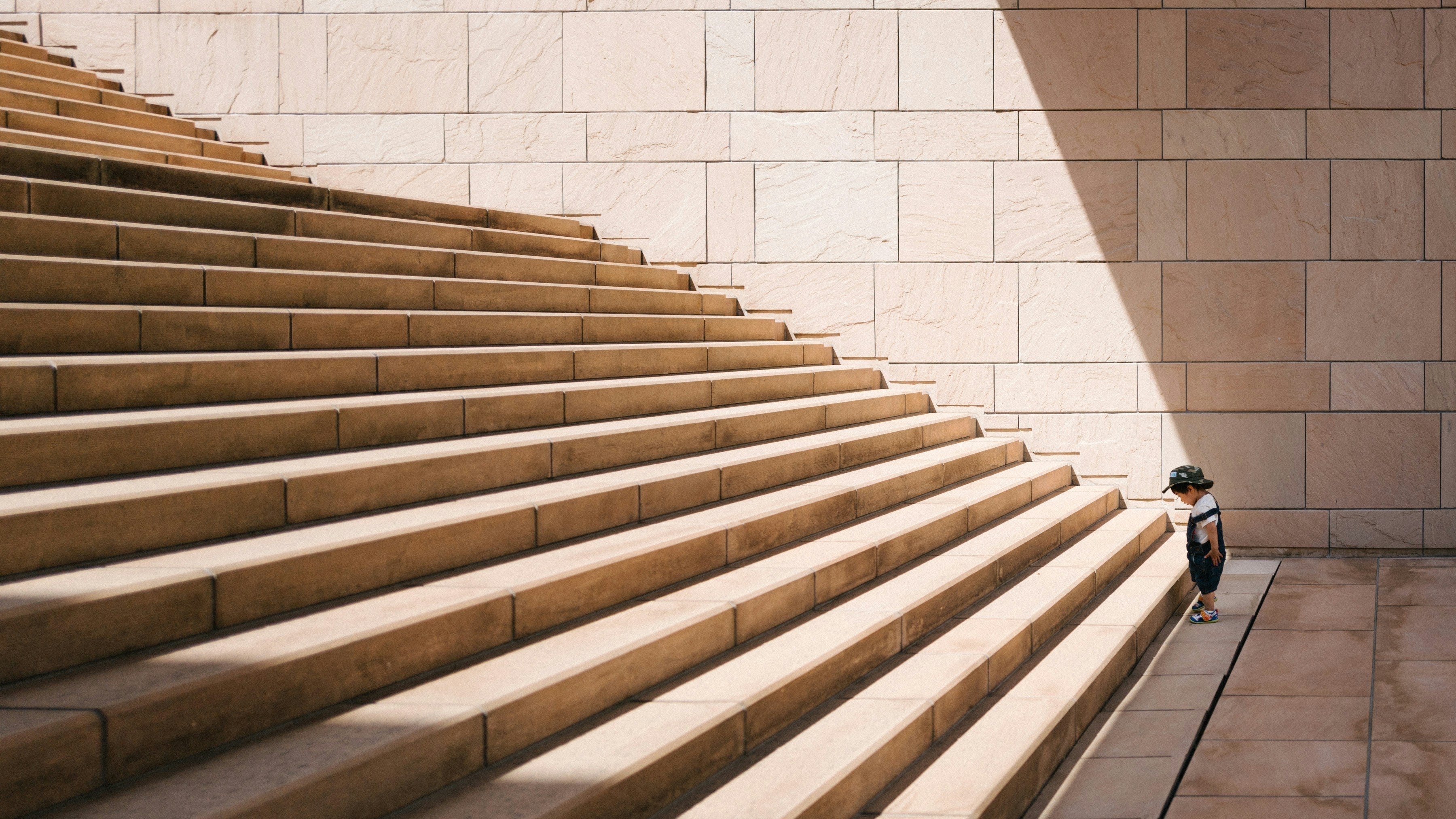A child standing in front of stairs